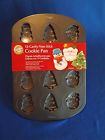 070896065186 Wilton New Christmas Cookie Pan Cavities Santa Snowman