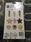 2115-1561 Wilton Seashell Candy And Lollipop Mold 070896145611 2115-1561 Wilton Seashell Candy And Lollipop Mold 070896145611