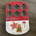 Wilton Cookie Shapes Pan Sheet Christmas Gingerbread Snowman Star 12 Cavities. Fixed Price $10.00.