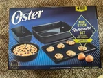 Oster - 4 Piece Non Stick Carbon Steel Bakeware Set Dark Blue New In Box. Fixed Price $29.00.