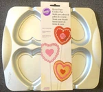 (new) Wilton Heart Pops Cookie Pan Valentines Day (makes 4) Fast Free Ship. Fixed Price $19.99.