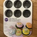 New 2010 Wilton 12 Cavity Non-stick Decorated Cookie Pan Egg #2105-0559. Fixed Price $14.50.