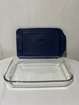 Pyrex Glass Casserole Pan With Blue Rubber Lid. Fixed Price $14.00.