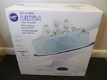 Wilton Tilt-n-turn Ultra Tilting Cake Turntable 12" Diameter X 7" High. Fixed Price $67.95.