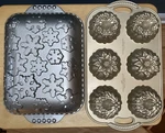 Nordic Ware Set Of 2 Holiday Pans Snowflake And Wreath Cakelette. Fixed Price $39.00.