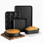 Ultra Nonstick Bakeware Set, 5 Piece Dishwasher Safe Baking Pans With Muffin. Fixed Price $55.36.