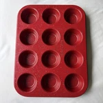 Casaware Mini Muffin Pan 12 Cup Ceramic Coated Non-stick Red Granite Unused. Fixed Price $15.00.