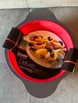 Boxiki 9 Inch Nonstick Silicone Round Cake Pan With Steel Frame Handles. Fixed Price $34.99.