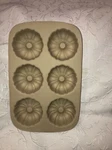 The Pampered Chef Classics Stoneware 6-MINI Fluted Bunt Pan #1441. Fixed Price $28.99.