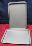 Pair Of Bakers Secret Baking Sheets 17" X 11" & 19" 12". Fixed Price $15.00.