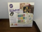 Wilton Checkerboard Cake Pan New In Box 3 Piece Set. Fixed Price $20.00.