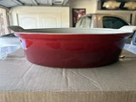 Creuset Stoneware Heritage Covered Oval Casserole, Qt 14" Cerise PG0405. Fixed Price $90.00.