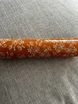 Temptations Floral Lace Orange Rolling Pin With Wooden Handles. Fixed Price $27.00.
