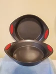 Rachael Ray Oven Lovin' 9'' Round Nonstick 2 Cake Pans W/ Orange Silicone Grips. Fixed Price $16.00.