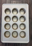 Oxo Good Grips Nonstick Pro Gold Coated 12 Cup Muffin Pan. Fixed Price $40.00.