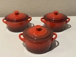 (3) Le Creuset Mini Round Cocotte Red Stoneware Pots With Lids. Fixed Price $59.99.