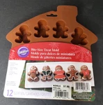Wilton Gingerbread Mold 12 Cavities Man & Girl Bite-size Silicone Treat. Fixed Price $10.99.