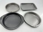 Wilton 4 Pc Baking Lot Brownie (11"X7"X1.5"), 3 Pie/dessert Pans (9"X1.5"). Fixed Price $38.06.