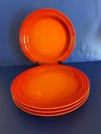4 Le Creuset Flame Orange Dinner Plates Stoneware Of 10 1/2" Second. Fixed Price $99.00.