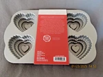 Nordic Ware Heavy Cast Aluminum Tiered Heart Pan- 6 Cakelets-new. Fixed Price $25.00.