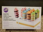 12 Treat Pops With Stand Kit- By Wilton New In Box. Fixed Price $6.00.