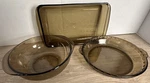 Vintage Pyrex Amber Smoke Glass Bakeware Set Bowl Pie Plate Casserole. Fixed Price $40.00.