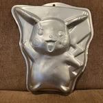 Vintage 90S Nintendo Pok Mon Pikachu Baking Mold Tin Cake Pan Poor Condition. Fixed Price $30.00.