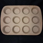The Pampered Chef Family Heritage Stoneware Classics 12 Cup Muffin Pan Beige Usa. Fixed Price $34.00.