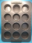 Anolon Advanced Non-stick Regular Size Muffin Pan 12 Count. Fixed Price $12.00.