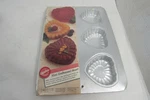 Wilton Mini Embossed Valentine Hearts Pan 6 Cavities Cakes New And Sealed. Fixed Price $13.99.