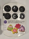 Wilton 12 Cookie Pan Princess Castle, Crown, Butterfly, Purse, Lips, Flowers-. Fixed Price $15.00.