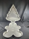 Lot 2 Vintage Collectible Wilton Big Cookie Pan Christmas Tree Gingerbread Man. Fixed Price $30.00.