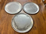 Three Rema Wearever Airbake Perforated Medium 13" Aluminum Pizza Pans. Fixed Price $70.00.