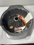 Wilton Ultra Bake Non-stick Fluted Tube Cake Pan 9 3/4 X 3/8. Fixed Price $12.00.