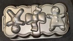 Christmas Gingerbread Loaf Pan Cast Aluminum Boy Girl Bow Nordic Ware. Fixed Price $10.00.