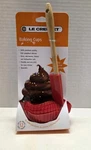 Le Creuset Cherry Red Silicone Spatula & 12 Baking Cups. Fixed Price $15.00.