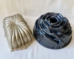 Set Of 2 Nordic Ware Cake Pans Dusty Rose 10 Cup Bundt & Fluted 6C Loaf Made Usa. Fixed Price $29.99.