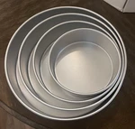 4 Piece Wilton Round Pan Set Performance Plus Layer Celebrations #2105-2932. Fixed Price $25.99.