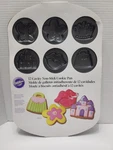 Wilton 12 Cookie Pan Princess Castle, Crown, Butterfly, Purse, Lips, Flowers-. Fixed Price $17.99.