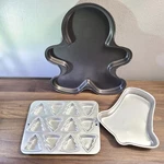 Wilton Pan Set Gingerbread Man 2105-6236 Bell 502-2057 12 Trees 2105-8463. Fixed Price $12.00.