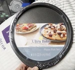 Wilton Ultra Bake Professional 4PC 9" Non-stick Pizza Pan Set Carbon Steel. Fixed Price $9.99.