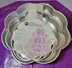 Wilton 4 Piece Tier Petal Shape Set Aluminum 15,12,9,6 Inch 2" Depth. Fixed Price $30.99.