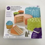 Wilton Deluxe Decorating Set 46 Pieces 18 Tips 24 Disposable Bags. Fixed Price $22.76.