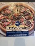 Wilton Perfect Results Premium Stoneware 15" Round Pizza With Rack. Fixed Price $52.00.