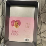 New Paris Hilton Nonstick Carbon Steel Bakeware 13" X 9" Cake Pan, Pink & Silver. Fixed Price $25.00.