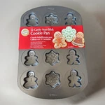 Wilton New 12-CAVITY Christmas Snowflake Gingerbread Man Non-stick Cookie Pan. Fixed Price $10.25.
