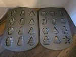 Wilton Non Stick Cookie Sheets, Pans, 24 Christmas Designs. Fixed Price $12.00.