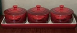 3 Le Creuset Red Cerise Mini Round Stoneware Cocotte Plus Tray. Fixed Price $75.00.
