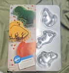 Wilton Aluminum Mini Dinosaur 3-CAVITY Cake Pan Silver 2105-9331. Fixed Price $13.00.