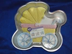 New Vintage Wilton Baby Buggy Cake Pan Stock Number 2105-3319 2005. Fixed Price $19.99.